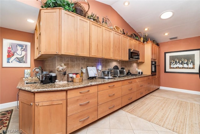 kitchen featuring light tile patterned flooring, sink, oven, light stone countertops, and decorative backsplash