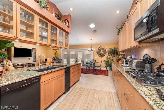 kitchen with light tile flooring, stainless steel appliances, tasteful backsplash, light stone countertops, and pendant lighting