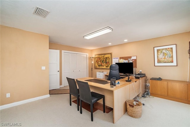 office area featuring light colored carpet