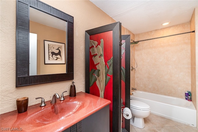 full bathroom featuring tiled shower / bath, a textured ceiling, tile floors, toilet, and vanity