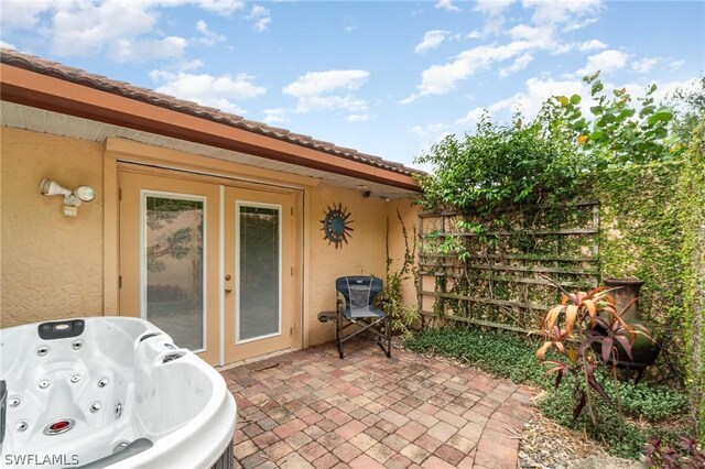 view of patio with a hot tub