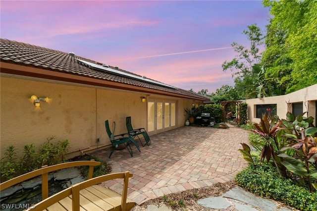 view of patio terrace at dusk