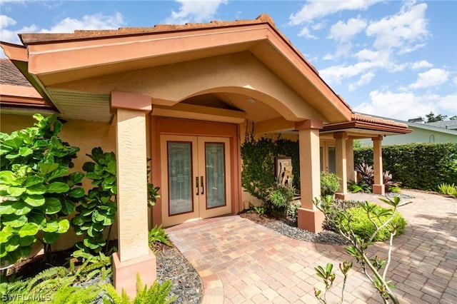 doorway to property featuring french doors and a patio area