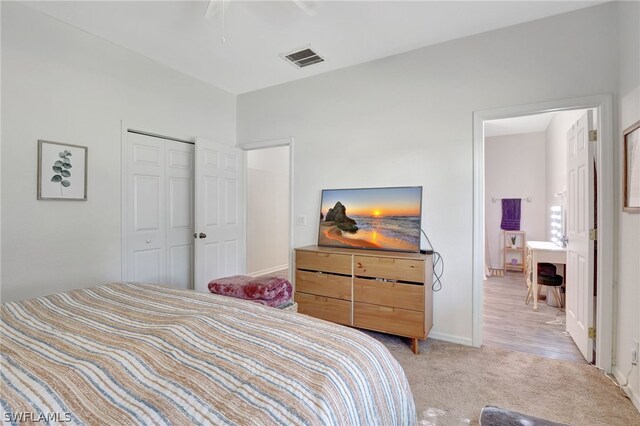 carpeted bedroom with a closet