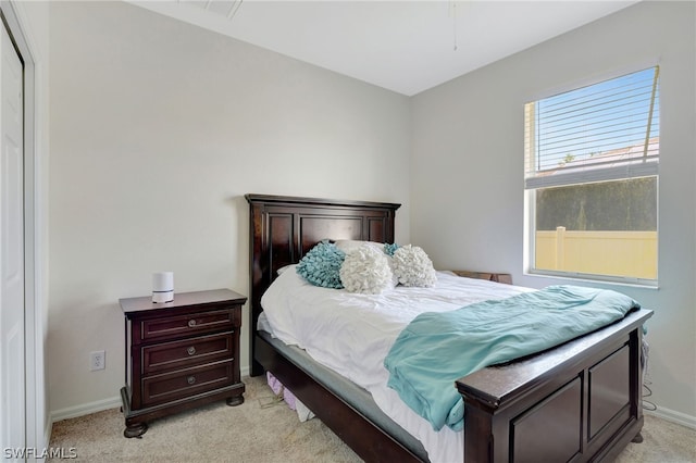 bedroom featuring light colored carpet