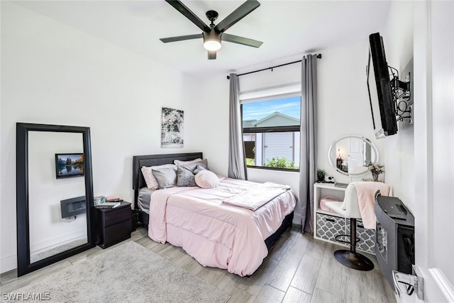 bedroom featuring ceiling fan and wood finished floors