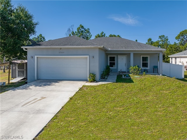 single story home with a front lawn and a garage