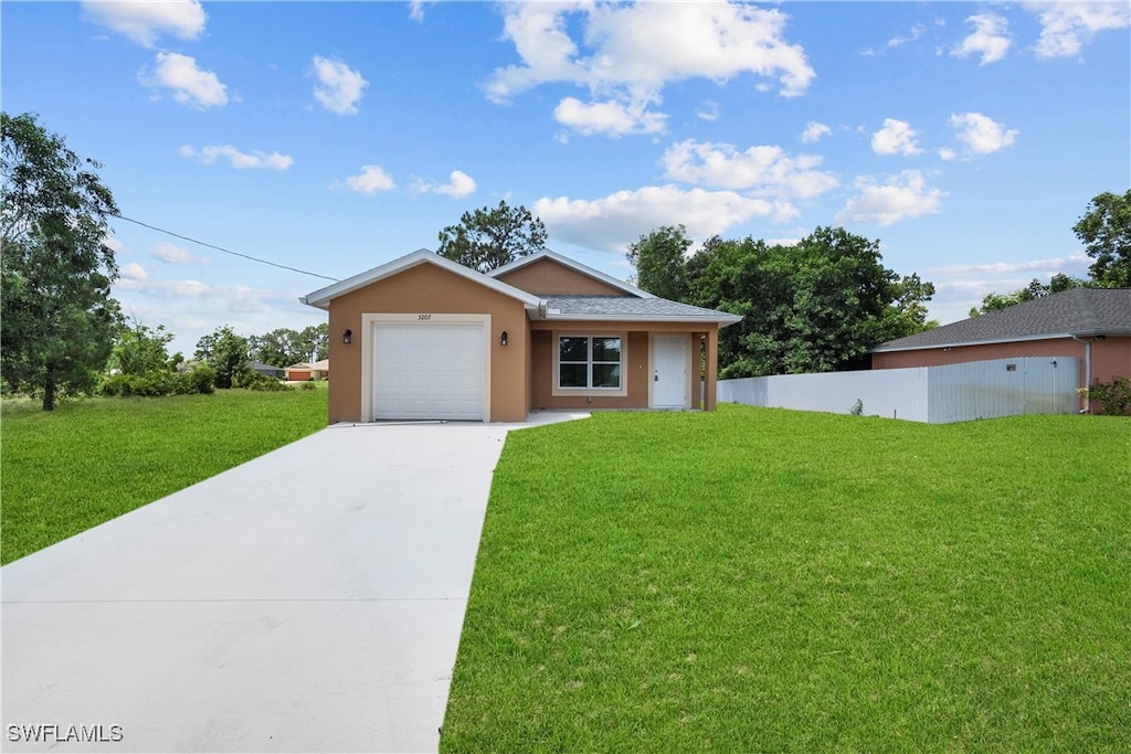 ranch-style home featuring a garage and a front yard