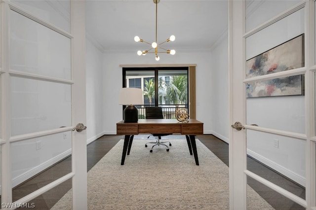 home office with french doors, dark hardwood / wood-style floors, crown molding, and a notable chandelier