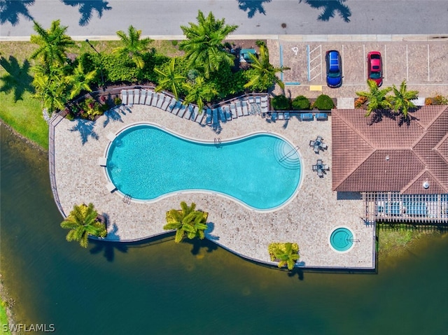 view of pool with a water view