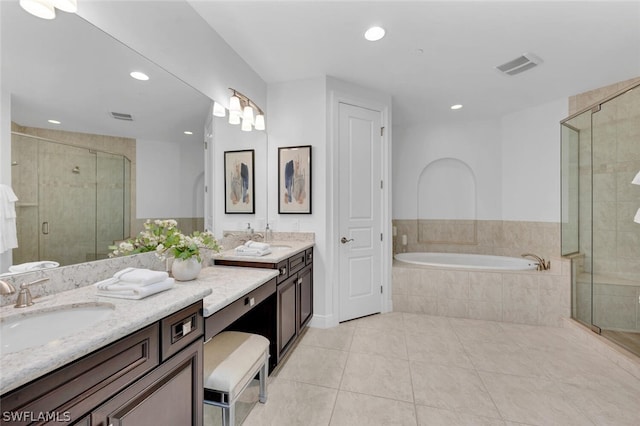 bathroom with independent shower and bath, tile patterned flooring, and vanity