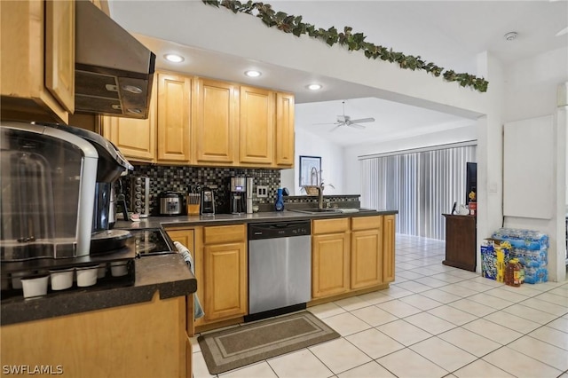 kitchen with sink, vaulted ceiling, stainless steel dishwasher, light tile patterned floors, and extractor fan