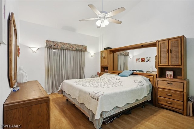 bedroom featuring ceiling fan and wood-type flooring