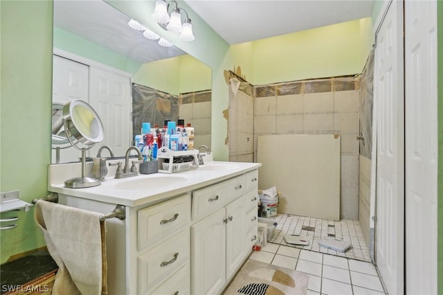 bathroom featuring tile patterned flooring and vanity