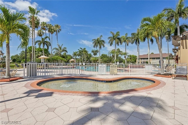 view of swimming pool featuring a patio area