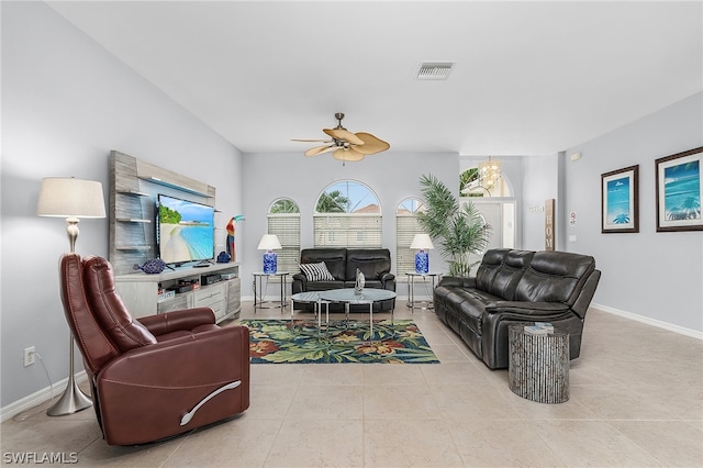 tiled living room featuring ceiling fan