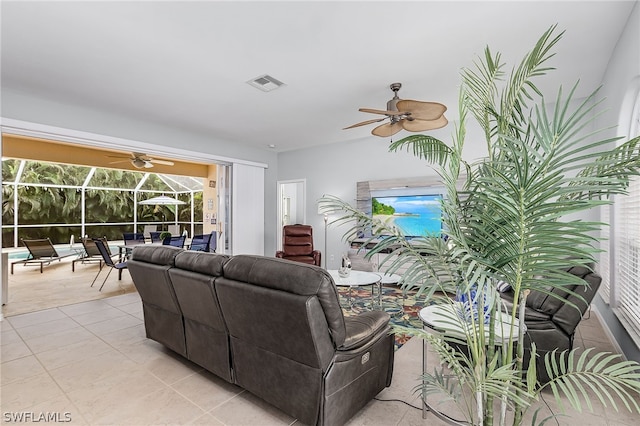 tiled living room with ceiling fan