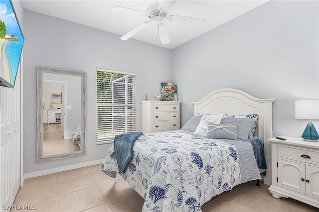 tiled bedroom featuring a closet and ceiling fan