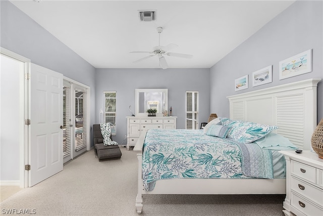 bedroom with light colored carpet, ceiling fan, and access to outside