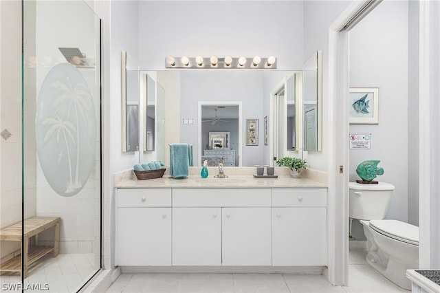 bathroom featuring an enclosed shower, tile flooring, large vanity, and toilet