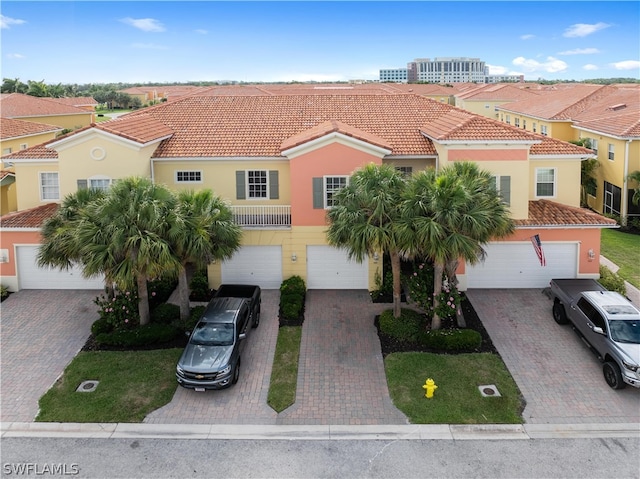 mediterranean / spanish-style home featuring a garage