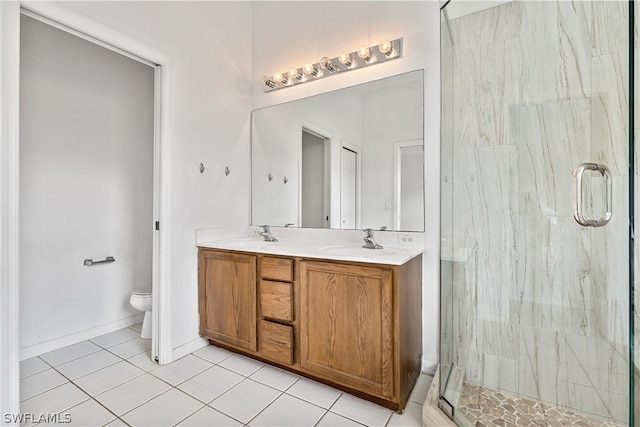 bathroom featuring walk in shower, tile flooring, dual vanity, and toilet