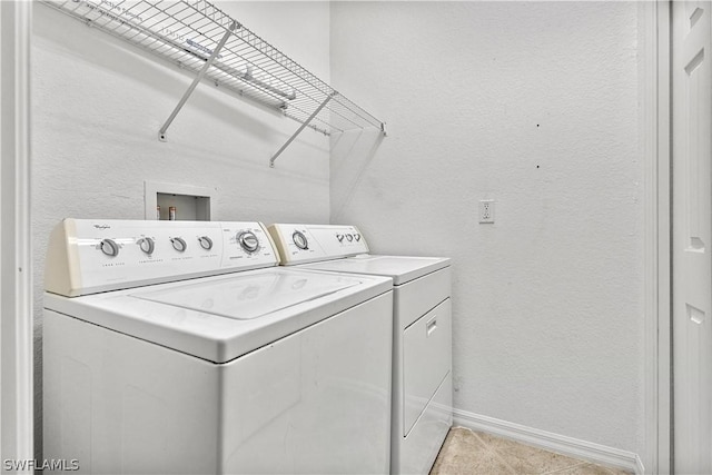 laundry area with washing machine and clothes dryer