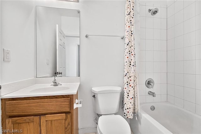 full bathroom featuring vanity, shower / bath combo, and toilet