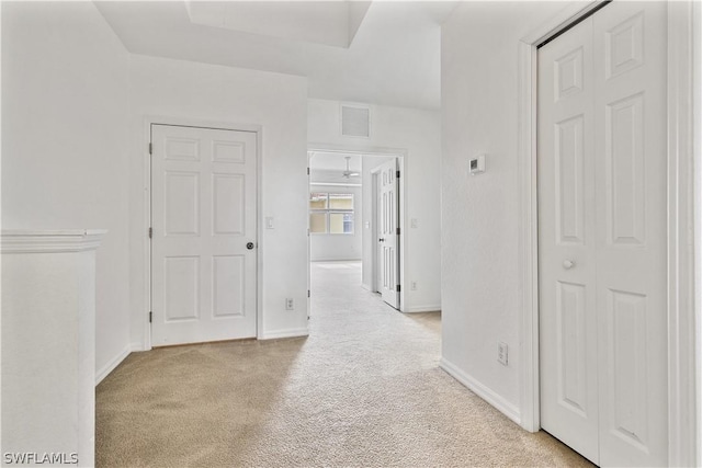 corridor with light colored carpet