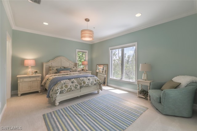 carpeted bedroom with ornamental molding