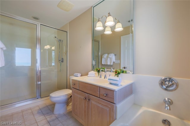 bathroom featuring tile patterned floors, vanity, toilet, and walk in shower