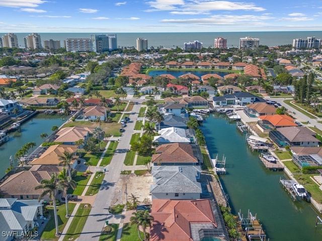 birds eye view of property featuring a water view