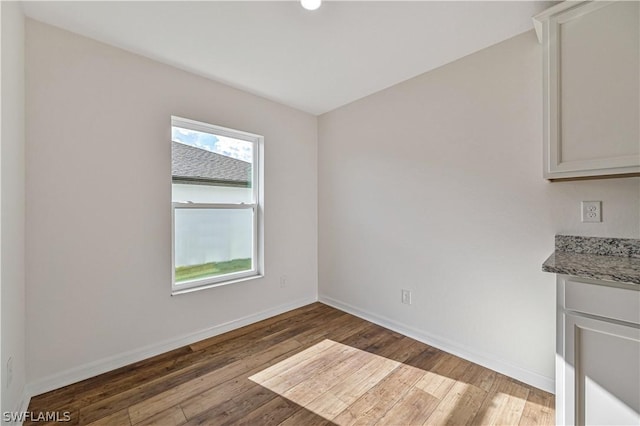 unfurnished dining area with hardwood / wood-style floors