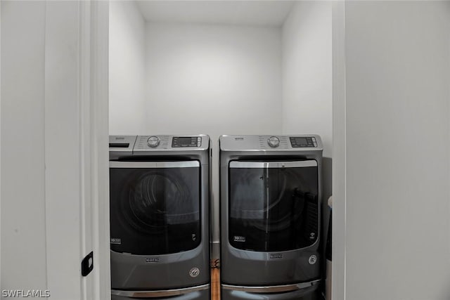 laundry room with washer and clothes dryer