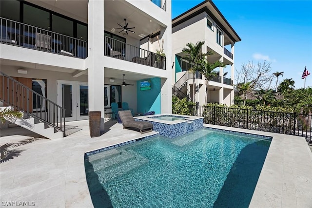 view of pool with an in ground hot tub, a patio area, ceiling fan, and french doors