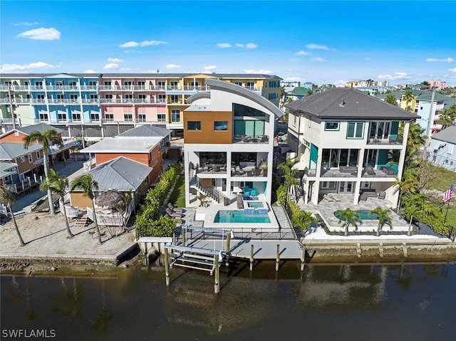 back of house with a water view