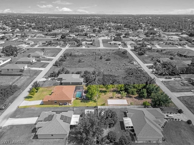 birds eye view of property with a residential view