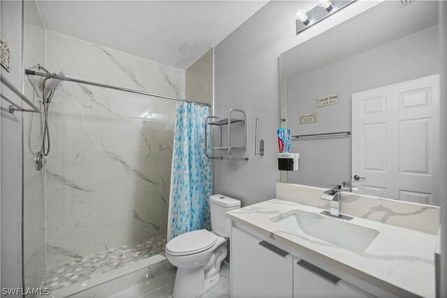 bathroom featuring a shower with curtain, tile flooring, large vanity, and toilet