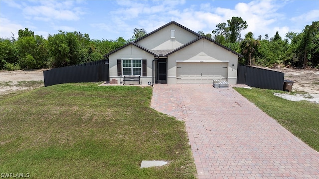 view of front of home featuring a front lawn and a garage