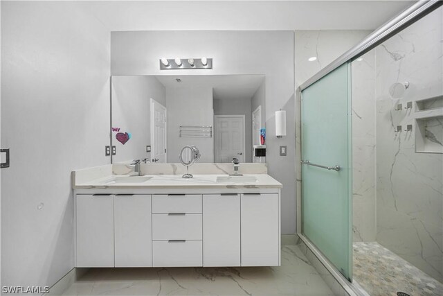 bathroom with walk in shower, tile flooring, oversized vanity, and double sink