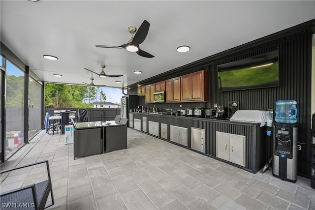 exterior space with backsplash, ceiling fan, and light tile floors