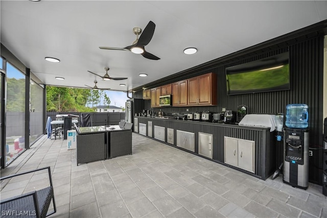 view of patio / terrace featuring area for grilling and ceiling fan