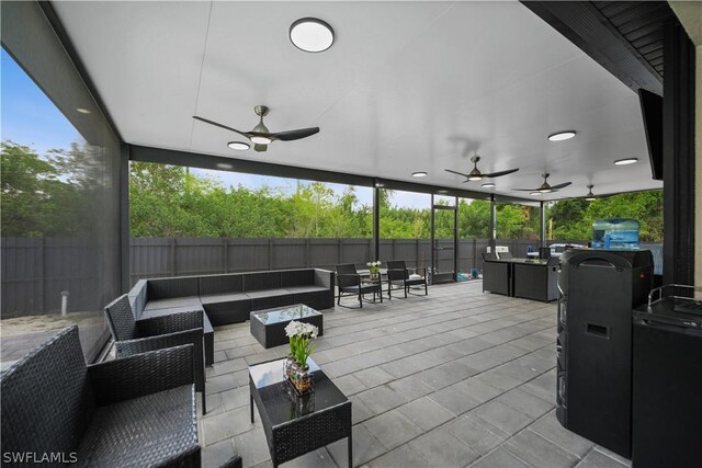 view of patio featuring outdoor lounge area and ceiling fan