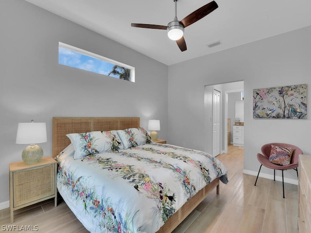 bedroom with ceiling fan and light hardwood / wood-style floors