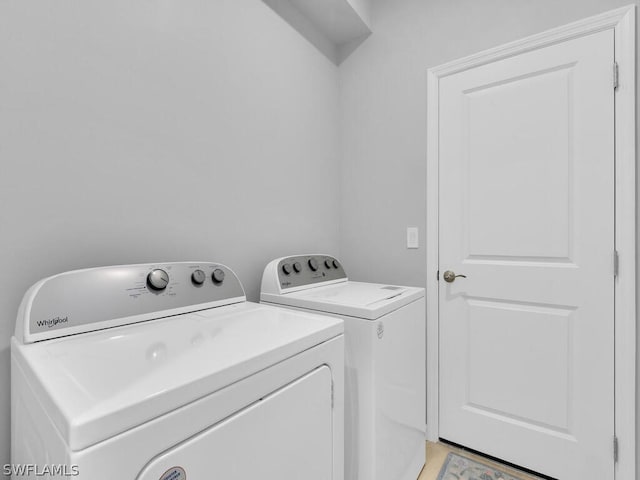 laundry room with washing machine and dryer