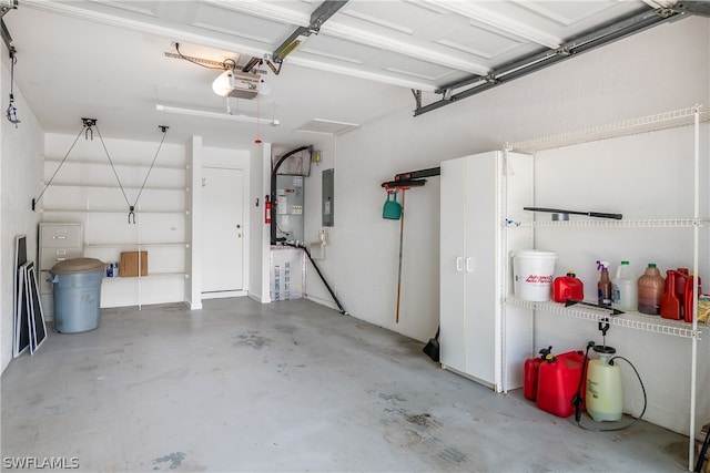 garage featuring electric panel and a garage door opener