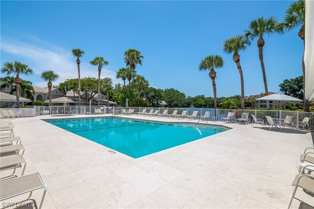 view of swimming pool with a patio area