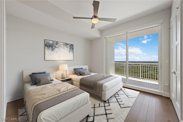 bedroom featuring access to outside, ceiling fan, and hardwood / wood-style floors