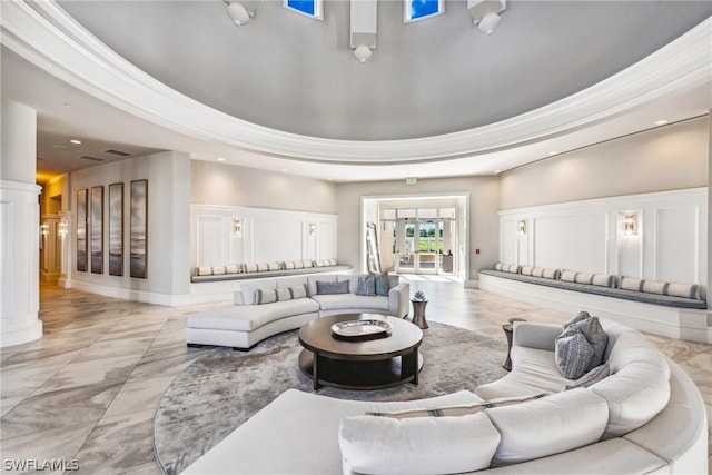 living room featuring a raised ceiling