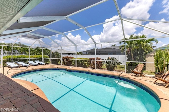 view of pool featuring a patio and a lanai